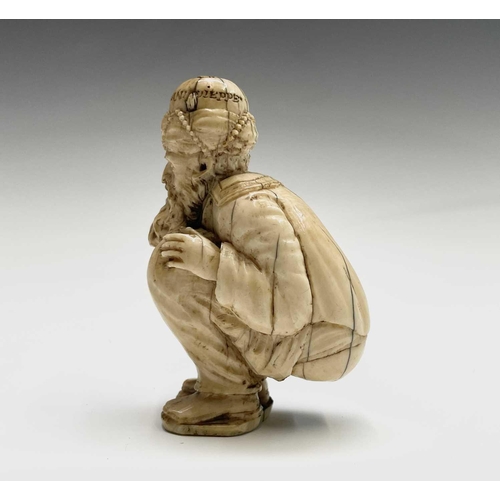 282 - A 19th century Dieppe ivory figure of a bearded man wearing a turban squatting, inscribed and dated ... 