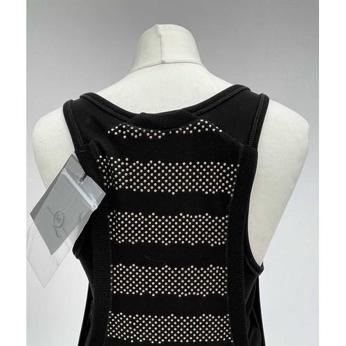 2822 - A MCQ by Alexandra McQueen sleeveless black dress, with raised gold dot horizontal banded decoration... 