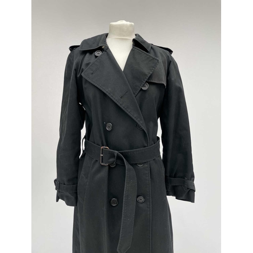 2823 - A ladies Burberry Prorsum black belted trench raincoat with Burberry check lining, label size long 1... 