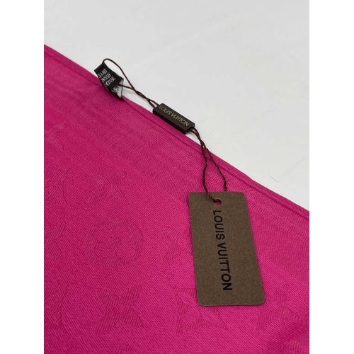 2824 - A Louis Vuitton pink monogram design cashmere and wool blend scarf, with tags. 70 x 182cm.