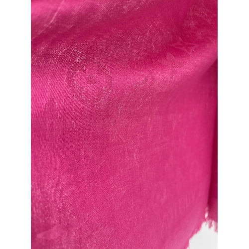 2824 - A Louis Vuitton pink monogram design cashmere and wool blend scarf, with tags. 70 x 182cm.