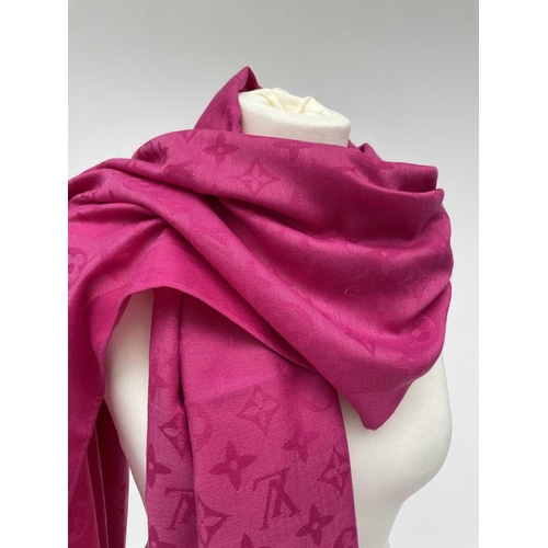 2824 - A Louis Vuitton pink monogram design cashmere and wool blend scarf, with tags. 70 x 182cm.