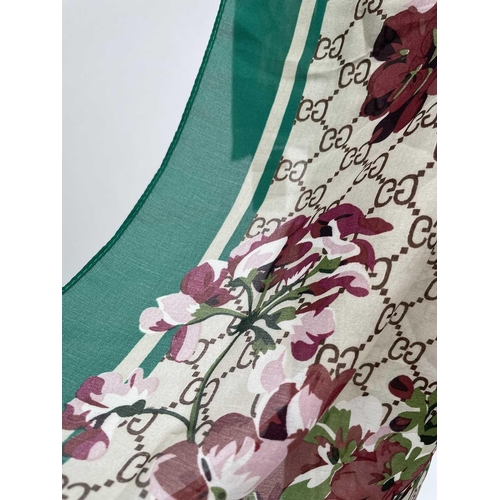 2825 - A Gucci 'Gucci Blooms' design silk scarf, with tags. 89 x 181cm.