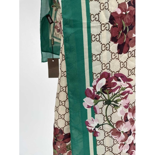 2825 - A Gucci 'Gucci Blooms' design silk scarf, with tags. 89 x 181cm.