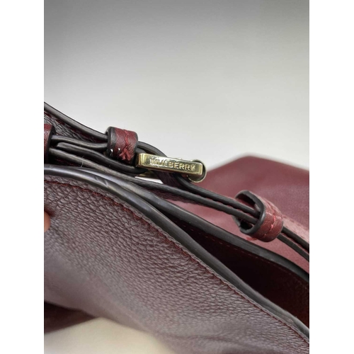 2827 - A Mulberry grained red leather handbag with gold coloured hardware. 32cm x 44cm (excluding strap).