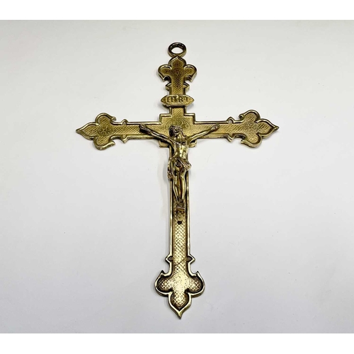 283 - A 20th century cast brass wall hanging crucifix, height 32cm, together with two large prints of a re... 