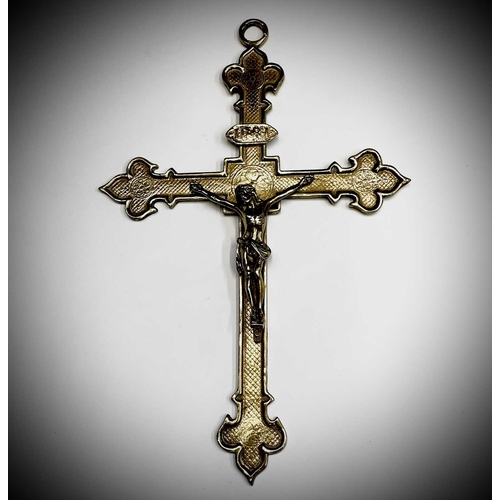 283 - A 20th century cast brass wall hanging crucifix, height 32cm, together with two large prints of a re... 