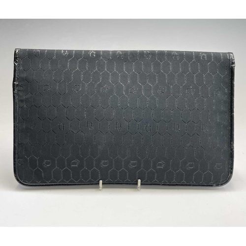 2831 - Christian Dior. Clutch bag in black fabric, patent leather trim, single magnetic fastener with Dior ... 