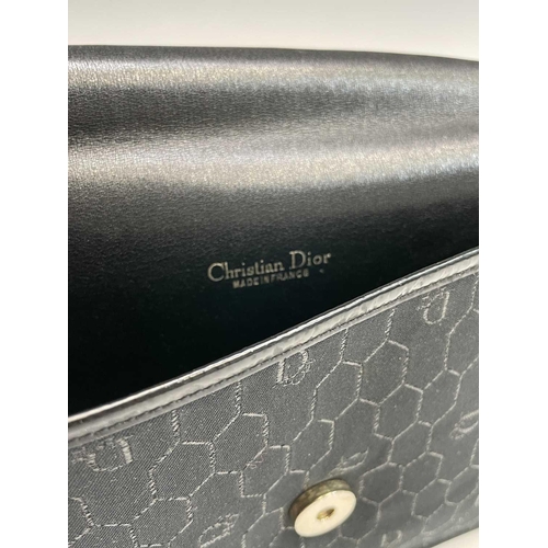 2831 - Christian Dior. Clutch bag in black fabric, patent leather trim, single magnetic fastener with Dior ... 