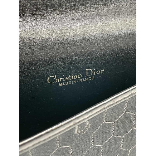 2831 - Christian Dior. Clutch bag in black fabric, patent leather trim, single magnetic fastener with Dior ... 