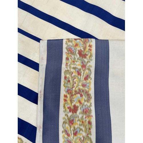 2839 - A roll of woven decorative fabric, blue and white stripes with floral border, approx 4 yards.