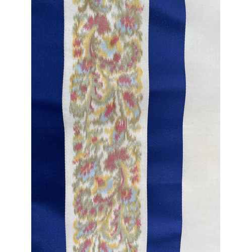 2839 - A roll of woven decorative fabric, blue and white stripes with floral border, approx 4 yards.