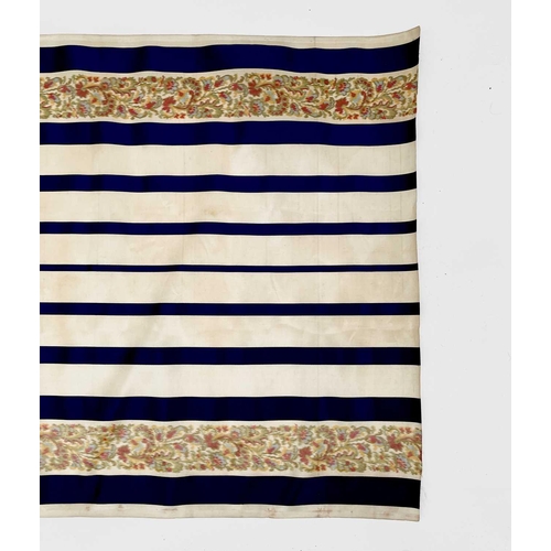 2839 - A roll of woven decorative fabric, blue and white stripes with floral border, approx 4 yards.