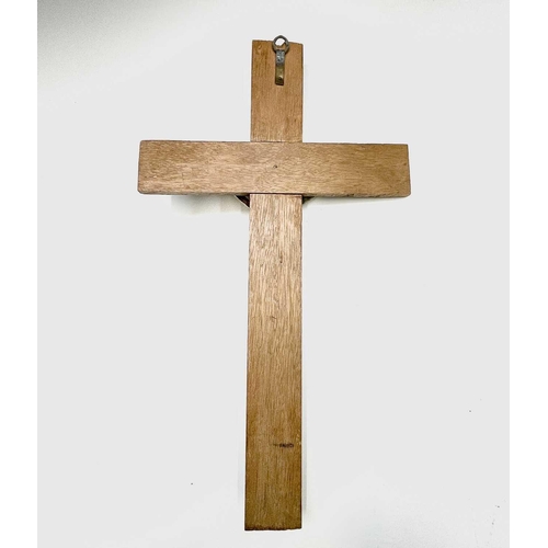 284 - A mid century oak mounted cast brass wall hanging crucifix. Overall height 47.5cm.