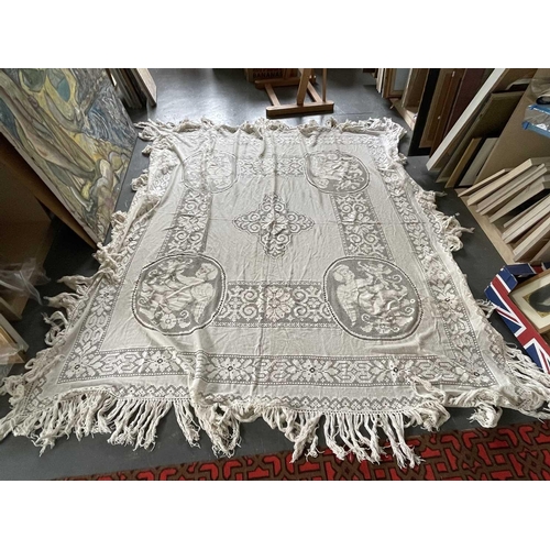 2844 - A machine lace counterpane with large cherub motifs, 220 x 220cm approx. (plus 20 cms fringing).