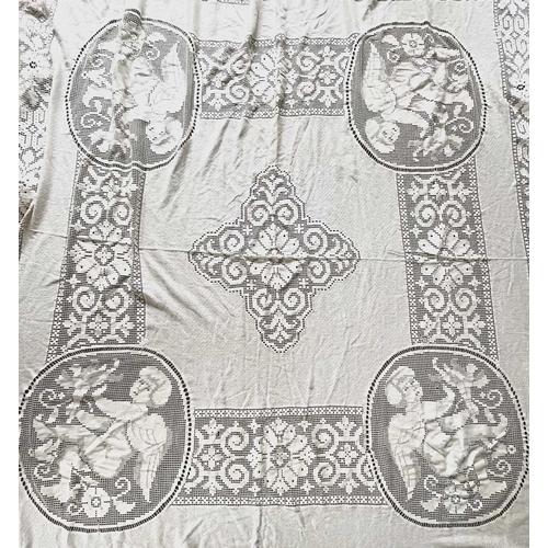 2844 - A machine lace counterpane with large cherub motifs, 220 x 220cm approx. (plus 20 cms fringing).