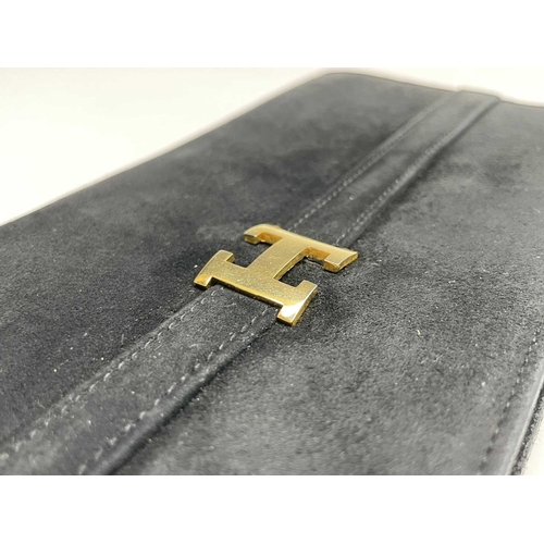 2851 - One black suede clutch bag and one other shoulder bag. The clutch with large interior compartment an... 