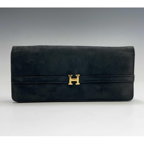 2851 - One black suede clutch bag and one other shoulder bag. The clutch with large interior compartment an... 