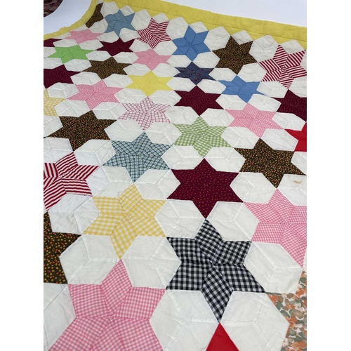 2853 - Patchwork quilts. Two quilts, in light colours and mixed plain, ginghams and floral fabrics. One wit... 