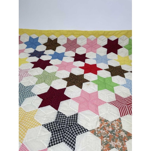 2853 - Patchwork quilts. Two quilts, in light colours and mixed plain, ginghams and floral fabrics. One wit... 