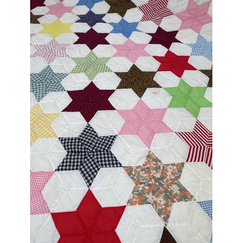 2853 - Patchwork quilts. Two quilts, in light colours and mixed plain, ginghams and floral fabrics. One wit... 