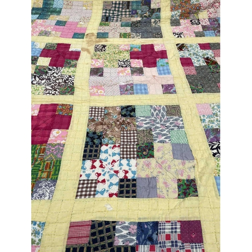 2855 - Patchwork quilts. One quilt with predominantly square and rectangular patches in multi coloured 1950... 