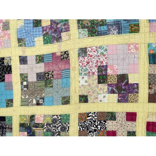 2855 - Patchwork quilts. One quilt with predominantly square and rectangular patches in multi coloured 1950... 