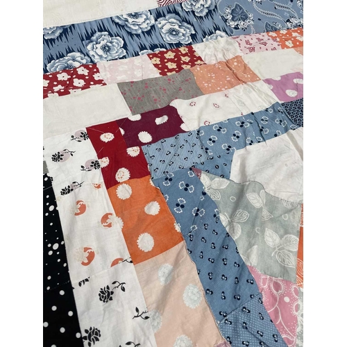 2855 - Patchwork quilts. One quilt with predominantly square and rectangular patches in multi coloured 1950... 