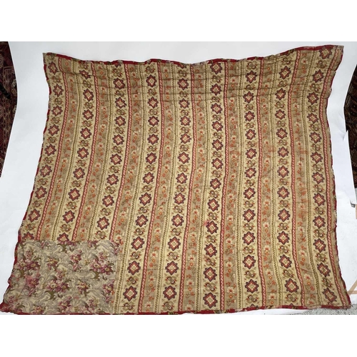 2857 - A heavy and thick red floral quilt together with a machine made tapestry style panel. The quilt 210x... 