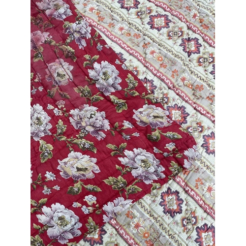 2857 - A heavy and thick red floral quilt together with a machine made tapestry style panel. The quilt 210x... 