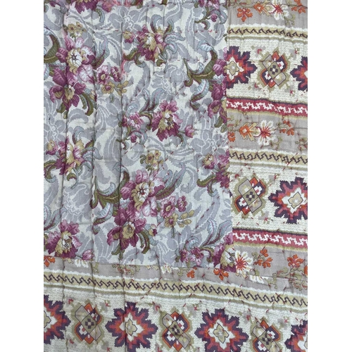 2857 - A heavy and thick red floral quilt together with a machine made tapestry style panel. The quilt 210x... 