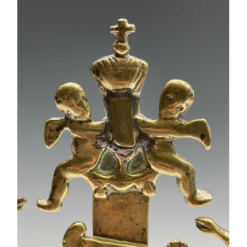 286 - A brass altar crucifix, cast with the figure of Christ beneath an INRI scroll, cherubim, and a skull... 