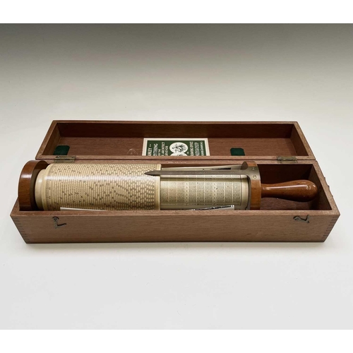 29 - A Stanley Fuller cylindrical calculator, with mahogany and brass fittings, in original case with lab... 