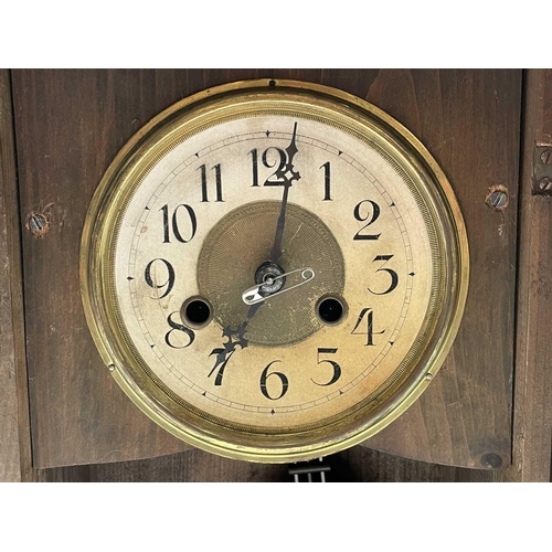 2903 - An American eight-day mantel clock, with stained pine case, striking on a coiled gong, height 56cm.