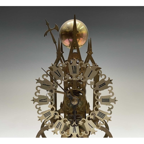 2909 - A brass cathedral skeleton clock, 20th century, with single fusee movement, striking on a bell, maho... 