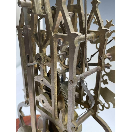 2909 - A brass cathedral skeleton clock, 20th century, with single fusee movement, striking on a bell, maho... 