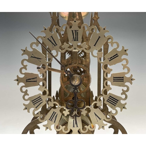 2909 - A brass cathedral skeleton clock, 20th century, with single fusee movement, striking on a bell, maho... 