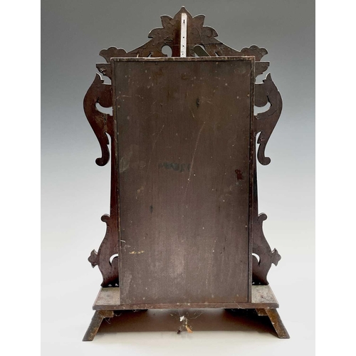 2911 - An American mantel alarm clock, by Seth Thomas, late 19th century, the walnut case with carved sides... 