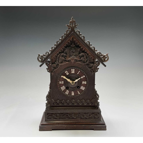 2915 - An oak and pine Black Forest cuckoo mantel clock, circa 1900, the case with carved and pierced decor... 