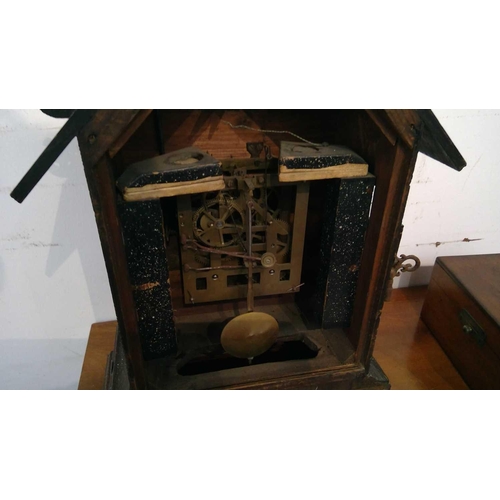 2915 - An oak and pine Black Forest cuckoo mantel clock, circa 1900, the case with carved and pierced decor... 