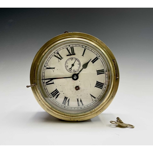 2916 - A brass cased ship's bulkhead wall clock, early 20th century, the painted dial with subsidiary secon... 