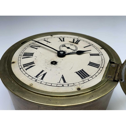 2916 - A brass cased ship's bulkhead wall clock, early 20th century, the painted dial with subsidiary secon... 