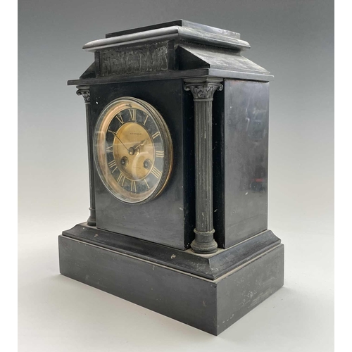 2923 - A 19th century black slate mantel clock of architectural form, with relief moulded spelter tablet an... 