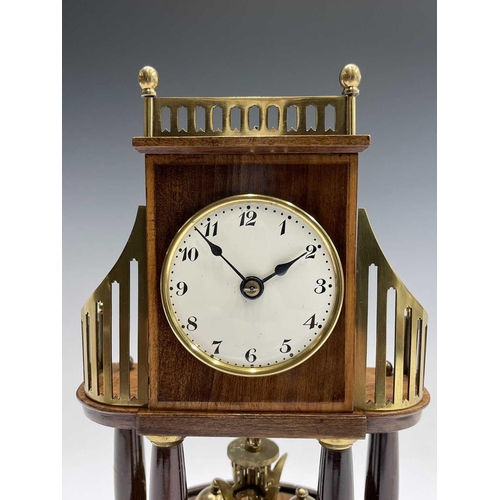 2926 - A Huber Uhren 400 day torsion clock, the white enamel dial with Arabic numerals, the brass and walnu... 