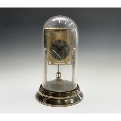 2927 - A Secessionist style brass 400 day torsion clock, circa 1910, the silvered circular dial with stylis... 