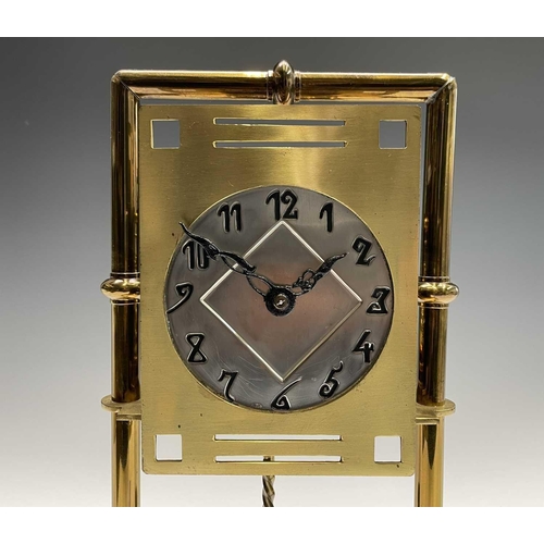 2927 - A Secessionist style brass 400 day torsion clock, circa 1910, the silvered circular dial with stylis... 