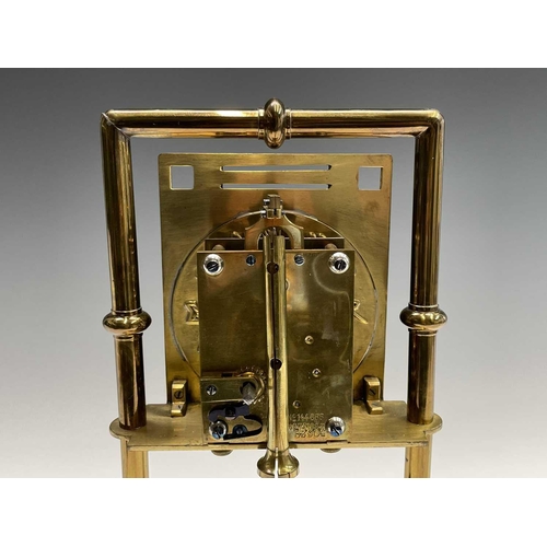 2927 - A Secessionist style brass 400 day torsion clock, circa 1910, the silvered circular dial with stylis... 