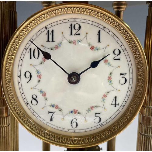 2928 - A 400 day brass torsion mantel clock, of portico type, with domed top, floral garland decorated dial... 