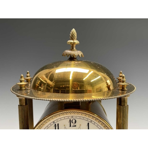 2928 - A 400 day brass torsion mantel clock, of portico type, with domed top, floral garland decorated dial... 