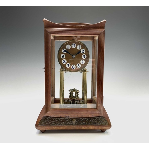 2929 - A walnut cased 400 day torsion clock, circa 1920, the brass framed circular copper dial with blue an... 